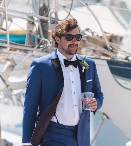 Eric wearing a tuxedo at a yacht club event